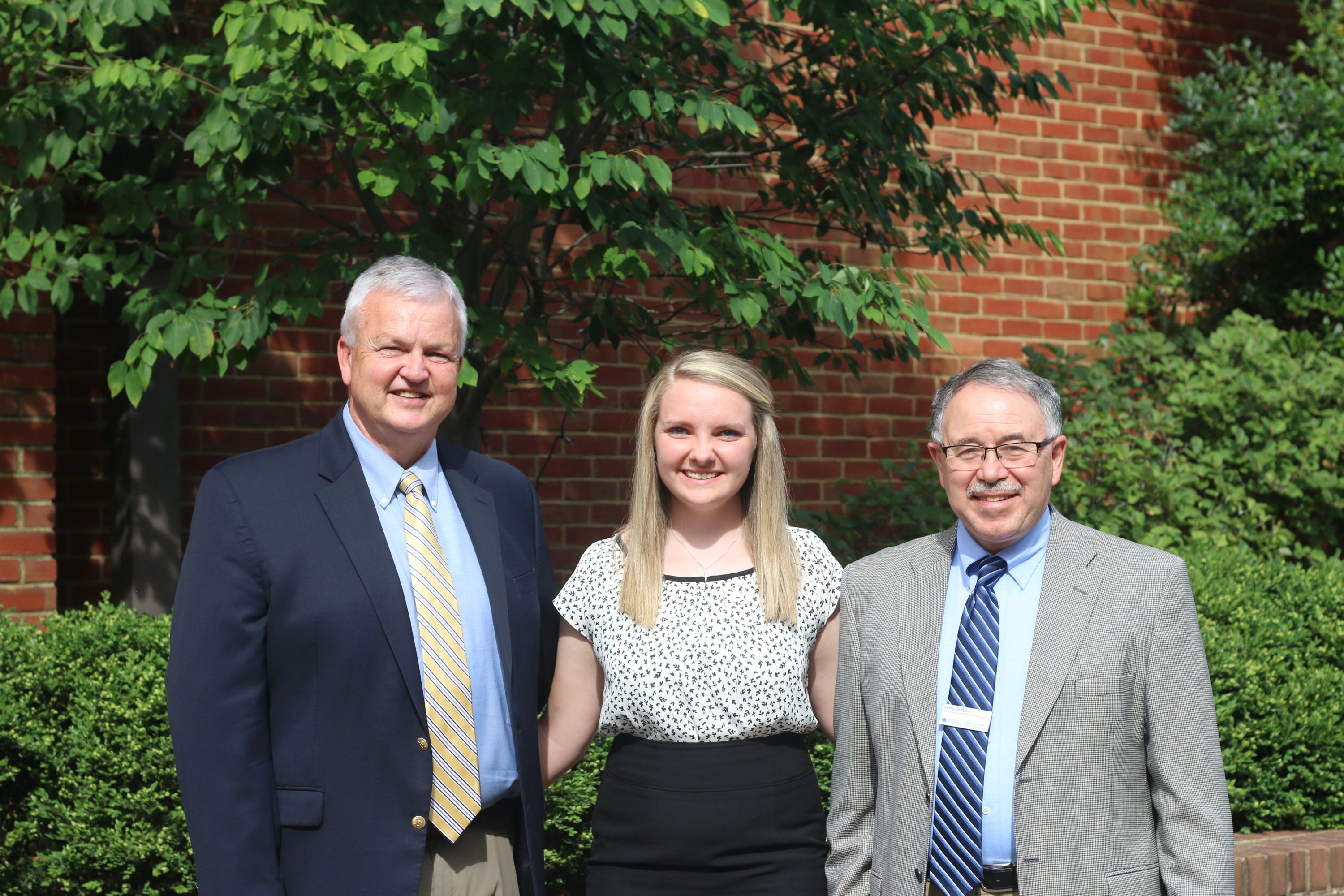 Clarissa Mackey (center) is greeted by Joe Cain, Kentucky Farm Bureau Director of Commodities (left), and Dr. Larry Grabau, Associate Dean for Academic Programs of the University of Kentucky College of Agriculture, Food and Environment (right), during the 2017 Institute for Future Agricultural Leaders (IFAL).