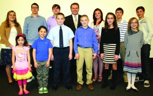 Agriculture Commissioner James Comer honored the statewide essay winners in the Kentucky Department of Agriculture’s Poster and Essay Contest during the Kentucky Agriculture Day luncheon March 27 in Frankfort. Statewide winners in each grade received $100 and an Honorary Commissioner of Agriculture certificate. Pictured are, from left: front row — Isis Carbollo, first grade, Breckinridge County; Vincent Mayfield, second grade, Daviess County; Andy Peeples, third grade, Daviess County; Michael Brockman, fourth grade, Boone County; Jennifer Solinger, sixth grade, Jefferson County; Anya Johnson, fifth grade, Boone County; back row — April Webb, 11th grade, LaRue County; Danny Ray Taylor, ninth grade, Boone County; Aaron Elswick, 10th grade, LaRue County; Laura Jane Phelps, 12th grade, Woodford County; Tucker Woolum, eighth grade, Bell County, and Cameron Taylor, seventh grade, Boone County. (Kentucky Department of Agriculture photo)