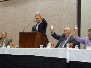 Kentucky Agriculture Commissioner, James Comer, raises a glass to open the Dairy Recognition Banquet.