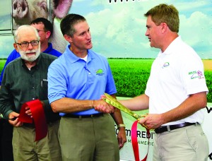 Agriculture Commissioner James Comer, right, shakes hands with Tod Griffin, chairman of Kentucky Agriculture and Environment in the Classroom Inc., following the ribbon-cutting to officially launch the Kentucky Department of Agriculture’s new Mobile Science Activity Centers Aug. 15 in the Kentucky Exposition Center in Louisville. At left is Dan Flanagan, who represented Farm Credit Mid-America and the Kentucky Poultry Federation. (Kentucky Department of Agriculture photo by Chris Aldridge)