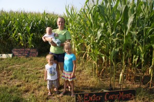Delaina Russell and children Mason (4 months), Lucas (2) and Hayden (5) at the entrance to the corn maze.