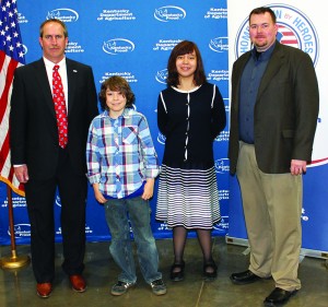 Ethan Carpenter, second from left, was the statewide digital art winner, and Lanta Willow Wright was the state runner-up digital winner in the Kentucky Department of Agriculture’s Poster and Essay Contest. At left is Deputy Agriculture Commissioner Steve Kelly, and at right is James Guffey, executive director of the Kentucky Poultry Federation and secretary-treasurer of Kentucky Agriculture and Environment in the Classroom Inc. (Kentucky Department of Agriculture photo)