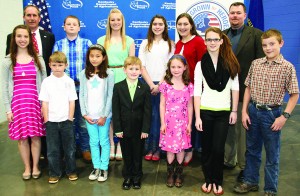 Essay winners honored at the Kentucky Agriculture Day Luncheon were, from left: front row — Sara Stults, Benjamin Wheat, Sayaka Church, Cyrus Bivens, Rory Shields, Kayla Wright, and Michael Brockman; back row — Steve Kelly, Kolby Hunt, Chasity Bryant, Lilly Mooney, Hannah Mooney, and Jamie Guffey. Not pictured are Andy Peeples (fourth grade) and Evan Clark (10th grade), both of Daviess County. (Kentucky Department of Agriculture photo)