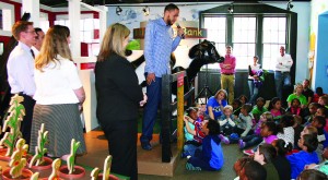Tayshaun Prince tells local children to eat their fruits and vegetables to grow up strong and healthy during the unveiling of the Farm To Market exhibit at The Explorium of Lexington. (Kentucky Department of Agriculture photo)